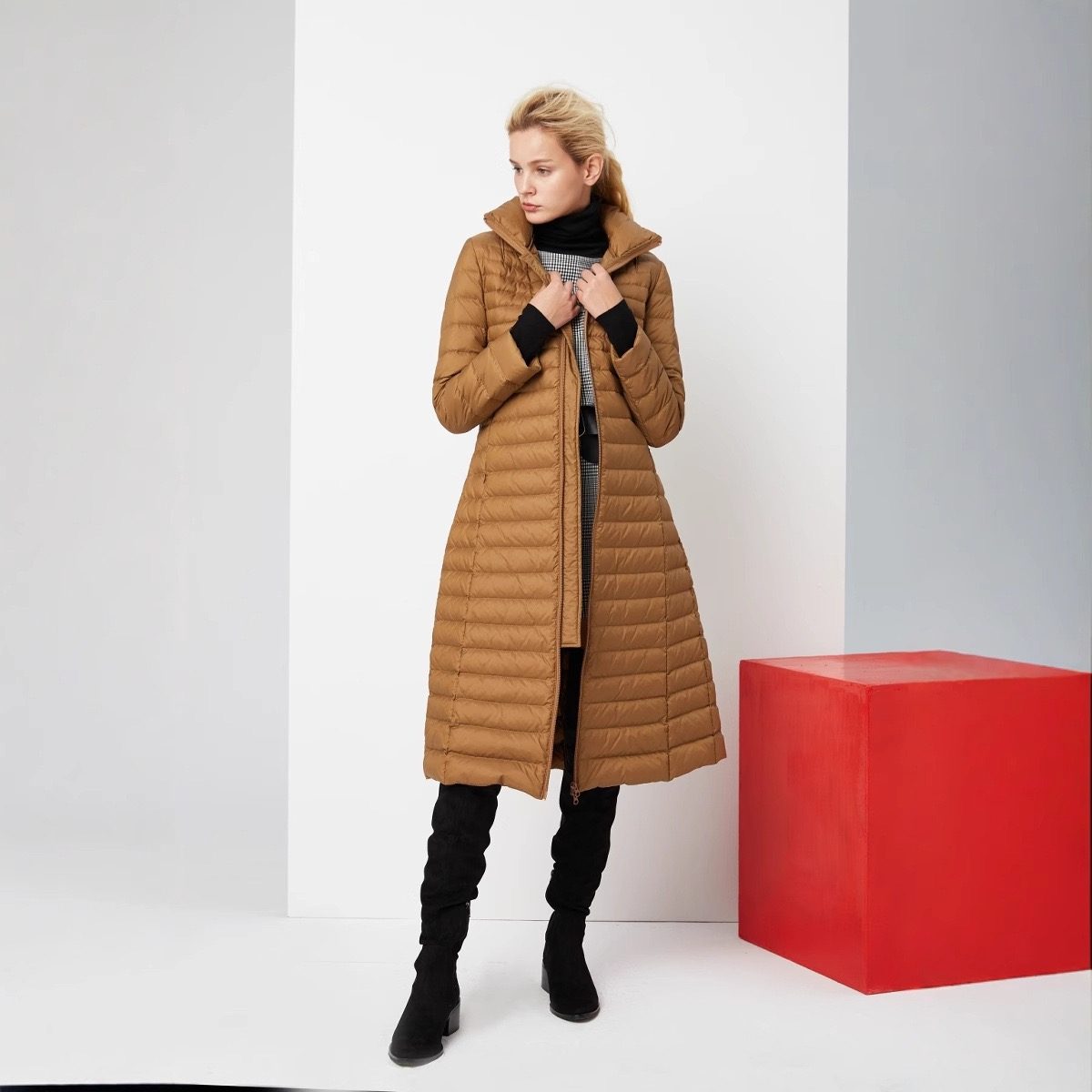 Woman wearing a long quilted puffer coat